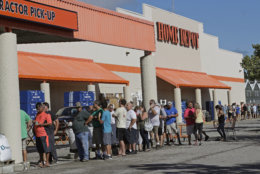 People line up outside a Home Depot for a new supply of generators and plywood in advance of Hurricane Florence in Wilmington, N.C., Wednesday, Sept. 12, 2018. Florence exploded into a potentially catastrophic hurricane Monday as it closed in on North and South Carolina, carrying winds up to 140 mph (220 kph) and water that could wreak havoc over a wide stretch of the eastern United States later this week. (AP Photo/Chuck Burton)