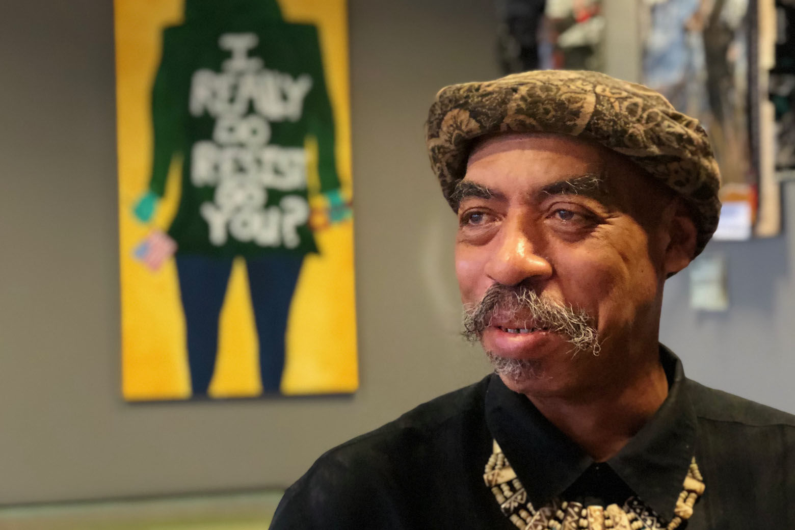 Darryl Burrell at Busboys and Poets in Takoma Park is a registered Democrat who said he votes in every election. He said he thinks Maryland Gov. Larry Hogan is more moderate than most Republicans but Democratic challenger Ben Jealous is getting his vote. (WTOP/Kate Ryan)