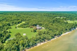 Peregrine Cliff is surrounded by lush trees. (Courtesy Cummings & Co. Realtors)