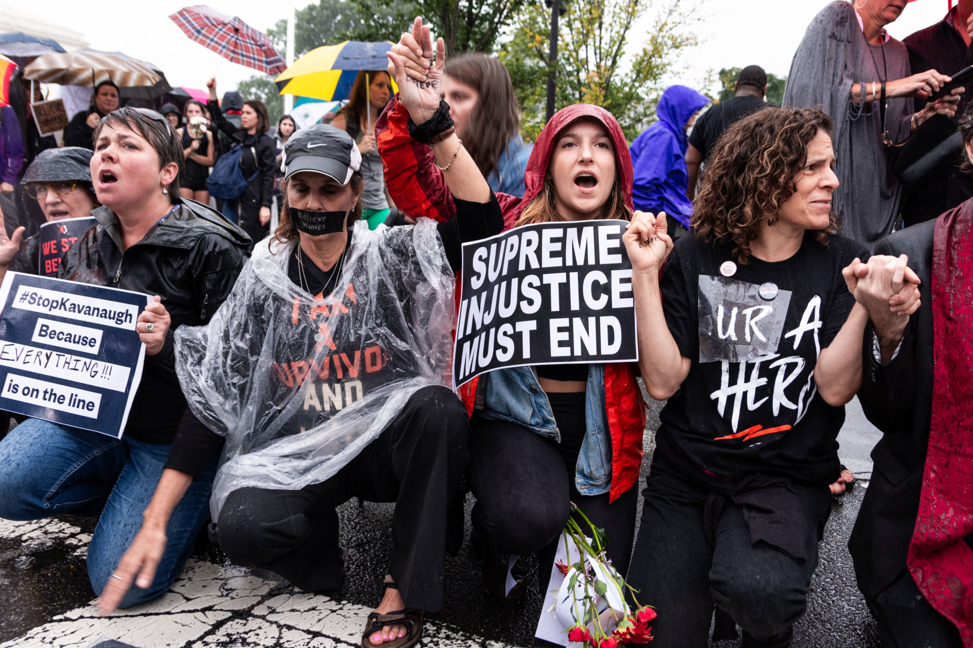 Women demonstrate in support of Christine Blasey Ford outside of the Supreme Court in D.C. on Thursday, September 28, 2018. (WTOP/Alejandro Alvarez)