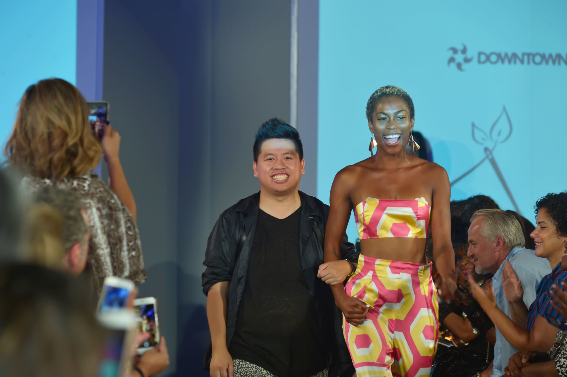 Fashion designer Frank Huynh of Fashions by Le Tam takes a final bow with a model wearing pieces from the label's spring/summer 2019 line at the DowntownDC Business Improvement District (BID) District of Fashion runway show. (Courtesy Shannon Finney/<a href="https://www.shannonfinneyphotography.com/index" target="_blank" rel="noopener noreferrer">shannonfinneyphotography.com</a>)