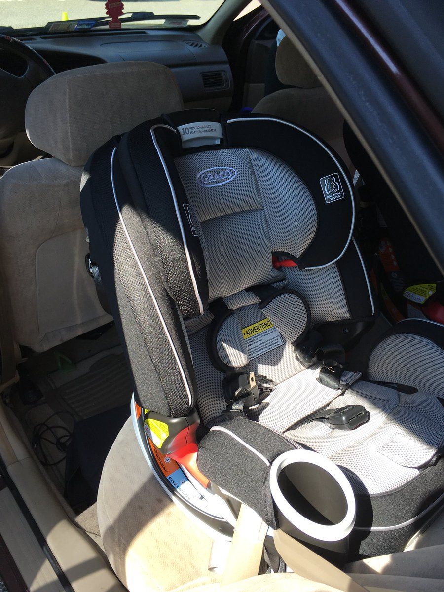 To make sure parents get the right information and keep children safe, law enforcement and safety advocates showed parents how to properly install car seats and answered common questions. (WTOP/Liz Anderson)