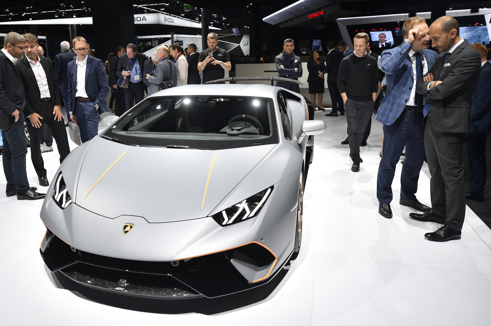 Visitors look at a Lamborghini Huracan Performante on the first media day of the International Frankfurt Motor Show IAA in Frankfurt, Germany, Tuesday, Sept. 12, 2017, which runs through Sept. 24, 2017. (AP Photo/Martin Meissner)