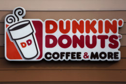 Dunkin' is serving up a new name and a free coffee on National Coffee Day: if you buy one hot coffee, you can get another hot coffee for free. (AP/Gene J. Puskar)
