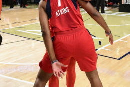 Washington Mystics guard Ariel Atkins (7) celebrates with guard Natasha Cloud after Game 5 of a WNBA basketball playoffs semifinal against the Atlanta Dream, Tuesday, Sept. 4, 2018, in Atlanta. The Mystics won 86-81 to advance to the finals. (AP Photo/John Amis)