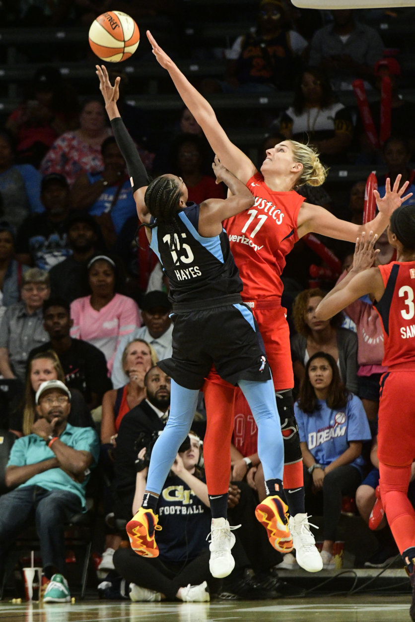 Atlanta Dream guard Tiffany Hayes (15) tries to get a shot off as Washington Mystics guard Elena Delle Donne (11) defends during the second half of Game 5 of a WNBA basketball playoffs semifinal Tuesday, Sept. 4, 2018, in Atlanta. The Mystics won 86-81. (AP Photo/John Amis)
