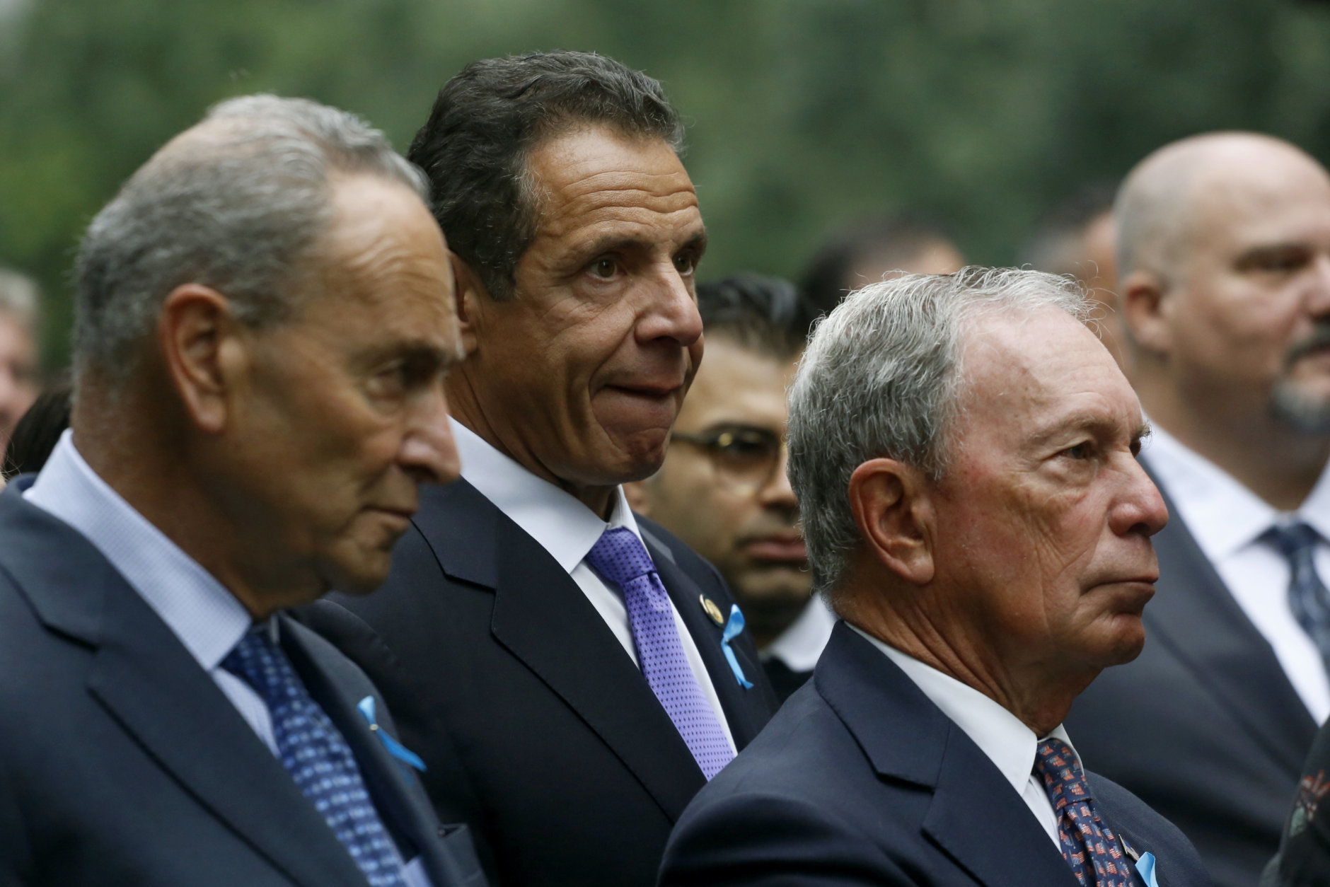 Attending a ceremony marking the 17th anniversary of the terrorist attacks on the United States are, left to right: U.S. Senator Chuck Schumer, D-NY, New York Gov. Andrew Cuomo, and former New York Mayor Michael Bloomberg, Tuesday, Sept. 11, 2018, in New York. (AP Photo/Mark Lennihan)