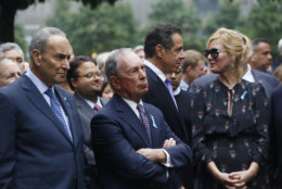From left, U.S. Senator Chuck Schumer, D-NY, former New York Mayor Michael Bloomberg, New York Gov. Andrew Cuomo and his girlfriend, TV chef Sandra Lee, attend the ceremony marking the 17th anniversary of the terrorist attacks on the United States, Tuesday, Sept. 11, 2018, in New York.  (AP Photo/Mark Lennihan)