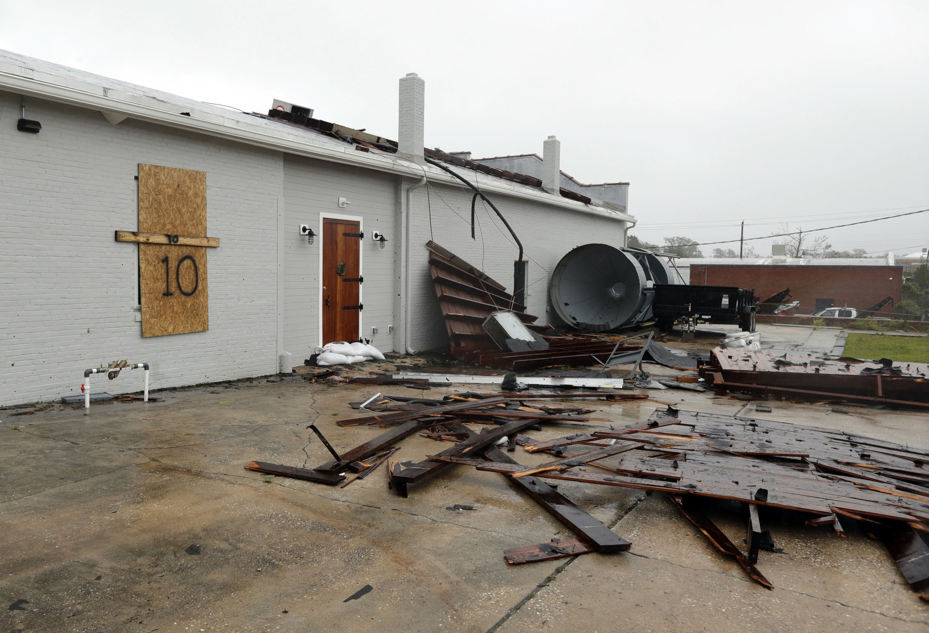 Part of the roof of Tidewater Brewing Co. lies on the ground in Wilmington, N.C., after Hurricane Florence made landfall Friday, Sept. 14, 2018. (AP Photo/Chuck Burton)
