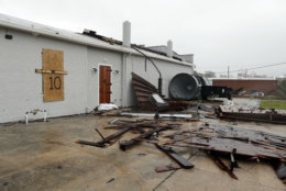 Part of the roof of Tidewater Brewing Co. lies on the ground in Wilmington, N.C., after Hurricane Florence made landfall Friday, Sept. 14, 2018. (AP Photo/Chuck Burton)
