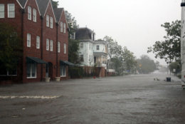 Flooding caused by Hurricane Florence covers blocks of Front Street in downtown New Bern, N.C.,  Friday, Sept. 14, 2018. (AP Photo/Chris Seward)