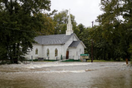 A church flooded by Hurricane Matthew two years ago is surrounded by rushing water as Florence continues to dump heavy rain in Fayetteville, N.C., Sunday, Sept. 16, 2018. (AP Photo/David Goldman)