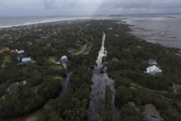 Coast Guard Road leading to the south end of Emerald Isle is seen after Hurricane Florence hit Emerald Isle, N.C., Sunday, Sept. 16, 2018. (AP Photo/Tom Copeland)