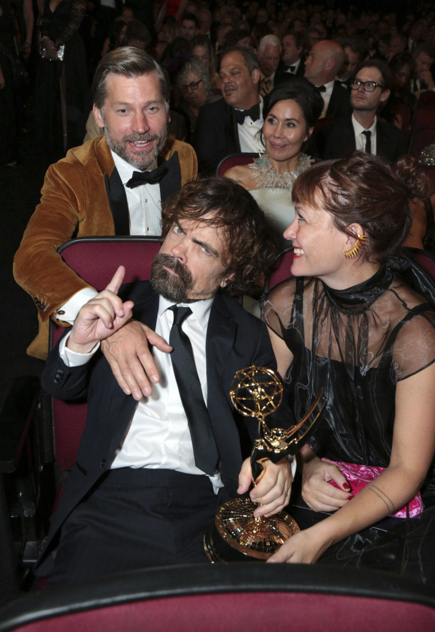 IMAGE DISTRIBUTED FOR THE TELEVISION ACADEMY - Nikolaj Coster-Waldu, Peter Dinklage and Erica Schmidt at the 70th Primetime Emmy Awards on Monday, Sept. 17, 2018, at the Microsoft Theater in Los Angeles. (Photo by Alex Berliner/Invision for the Television Academy/AP Images)