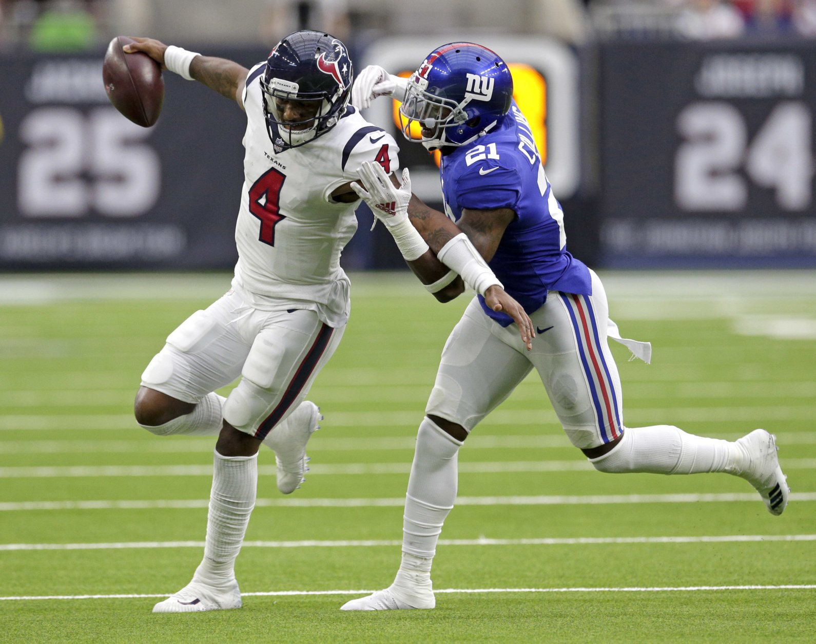 Houston Texans quarterback Deshaun Watson (4) is tackled by New York Giants defensive back Landon Collins (21) during the first half of an NFL football game Sunday, Sept. 23, 2018, in Houston. (AP Photo/Michael Wyke)
