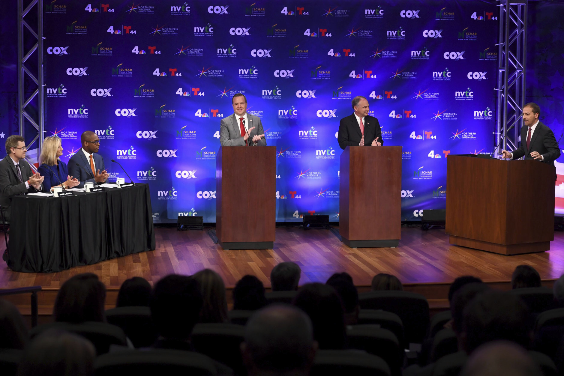 Republican Corey Stewart, at left podium, and Democratic U.S. Sen. Tim Kaine, at center podium, participate in a senatorial debate as moderator Chuck Todd stands at right, Wednesday, Sept. 26, 2018, at Capital One headquarters, in McLean, Va. (Katherine Frey/The Washington Post via AP, Pool)