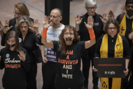 Protesters demonstrate in the Hart Senate Office Building as the Senate Judiciary Committee hears from Supreme Court nominee Brett Kavanaugh and Christine Blasey Ford on Capitol Hill in Washington, Thursday, Sept. 27, 2018. (AP Photo/J. Scott Applewhite)