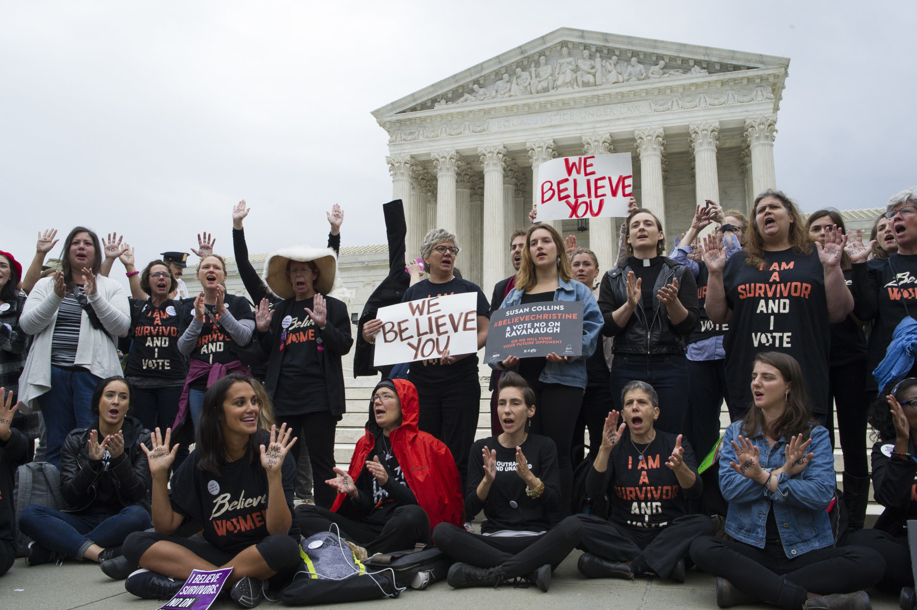 Women supporters of Christine Blasey Ford demonstrate in front of the Supreme Court in Washington, Thursday, Sept. 27, 2018. The Senate Judiciary Committee will hold a hearing today with Supreme Court Nominee Brett Kavanaugh and Christine Blasey Ford, the woman who says he sexually assaulted her. (AP Photo/Cliff Owen)