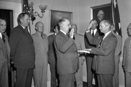 James V. Forrestal (right foreground) takes oath as the nations first secretary of defense, administered by chief justice Fred M. Vinson (center) at the navy department in Washington on Sept. 17, 1947. Witnessing the ceremony, left to right, are: Secretary of War Kenneth Royall; Army Chief of Staff Dwight D. Eisenhower; Navy Undersecretary John; Chester W. Nimitz; Undersecretary of War S. Stuart Symington and General Carl Spaatz, Air Force Chief. (AP Photo/WX)