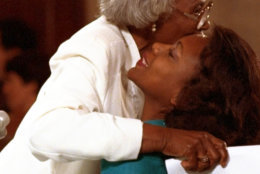 FILE - This Oct. 11, 1991 file photo shows University of Oklahoma law professor Anita Hill receiving a hug from her mother, Erma, after making opening comments to the Senate Judiciary Committee on Capitol Hill in Washington.  Hill made national headlines in 1991 when she testified that then-Supreme Court nominee Clarence Thomas had sexually harassed her. Now, more than 20 years later, director Freida Mock explores Hill's landmark testimony and the resulting social and political changes in the documentary "Anita." (AP Photo/Greg Gibson, File)