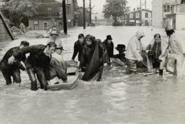 ** ADVANCE FOR SUNDAY, JUNE 16, 2002  FILE ** This June 23, 1972 file photo shows people being rescued by boat from their homes to dry ground after  Hurricane Agnes forced the Susquehanna River to overflow its banks causing heavy flooding in  Harrisburg, Pa. (AP Photo/Paul Vathis, File)
