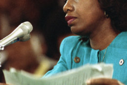 University of Oklahoma law professor Anita Hill straightens papers after making her opening statement to the Senate Judiciary Committee on Capitol Hill in Washington, Friday, Oct. 11, 1991. Hill testified that Supreme Court nominee Judge Clarence Thomas repeatedly would ?use work situations to discuss sex.? (AP Photo/Greg Gibson)