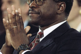 Judge Clarence Thomas pauses during testimony before the Senate Judiciary Committee on Capitol Hill in Washington, Oct. 11, 1991. A calm and resolute Thomas categorically denied Anita Hill's accusations of sexual harassment and told a tense session of the committee, "confirm me if you want," but that "no job is worth" what he has been through. (AP Photo/Greg Gibson)