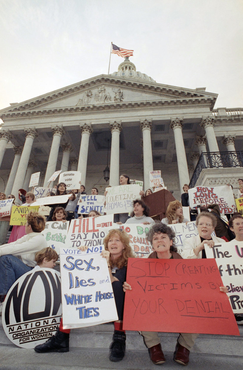 Women protest the nomination of Clarence Thomas for the Supreme Court on the steps of the U.S. Capitol in Washington, Tuesday, Oct. 15, 1991. Thomas gained enough Senate commitments to virtually assure confirmation on Tuesday at night as the heart of his Democratic support stood firm despite Anita Hill?s explosive charges of sexual harassment. (AP Photo/Ron Edmonds)