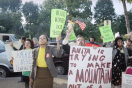 Demonstrators on Capitol Hill yell toward the Russell Senate Office Building in Support of Supreme Court nominee Clarence Thomas in Washington, Oct. 15, 1991 as the Senate debated the Thomas nomination. The confirmation vote is expected on Tuesday. (AP Photo/Ron Edmonds)