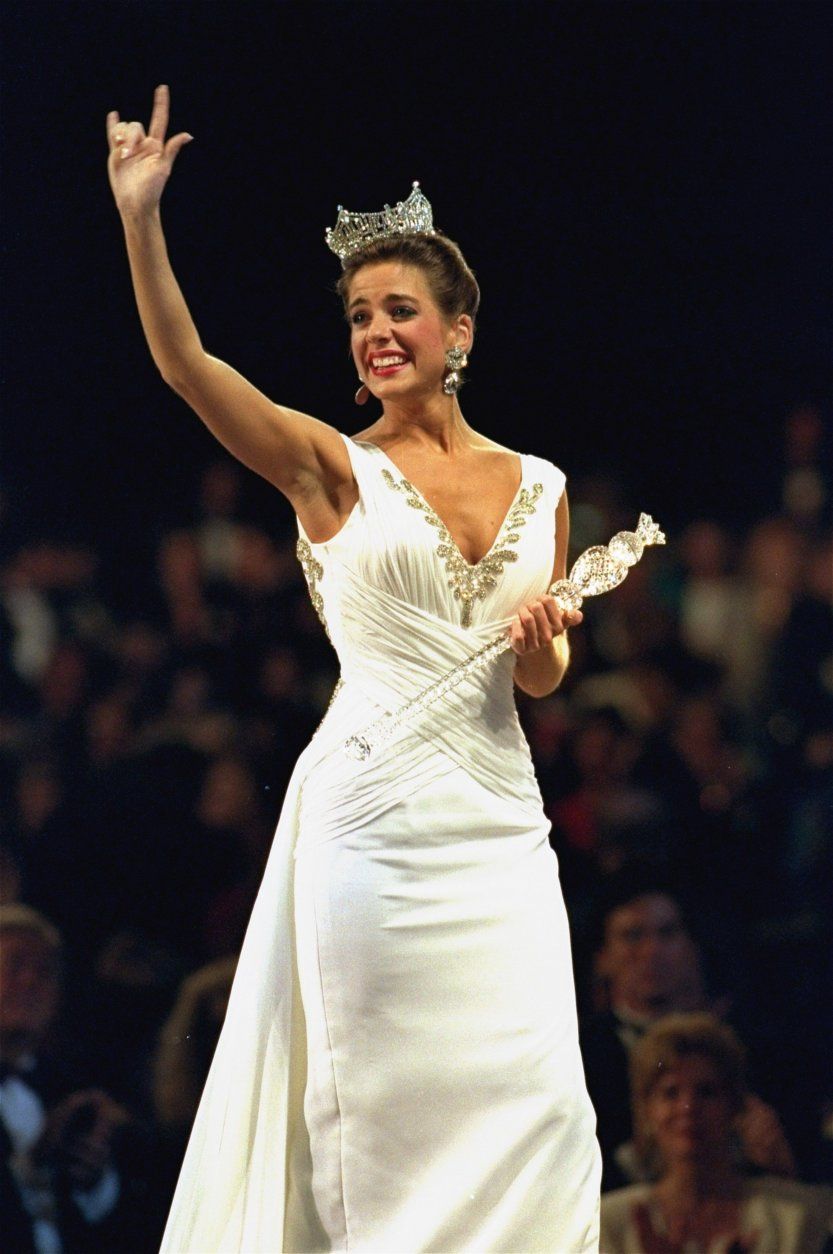 Miss America 1995 Heather Whitestone, the former Miss Alabama, walks down the runway and signs "I Love You" to the crowd after she won the 74th annual pageant in the Atlantic City Convention Hall Saturday, September 17, 1994. (AP Photo/Tom Costello)