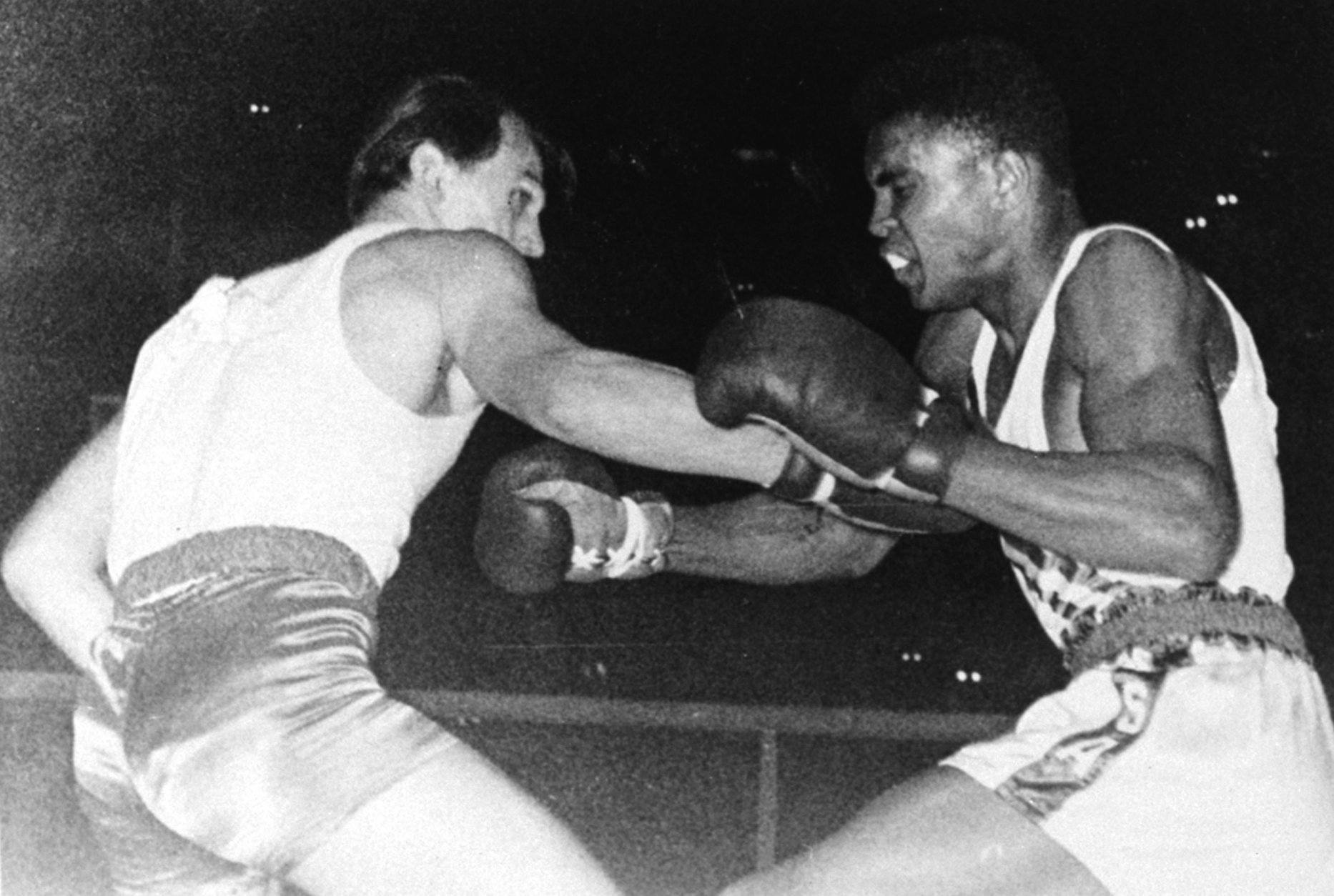 United States Olympic boxer Cassius Clay of Louisville, KY, right, is shown in action during the Olympic bout against Z. Pietrzykowski of Poland in Rome, Italy, September 5, 1960.  Clay outpointed the Pole and won the gold medal in the light heavyweight class for the United States.  (AP Photo)