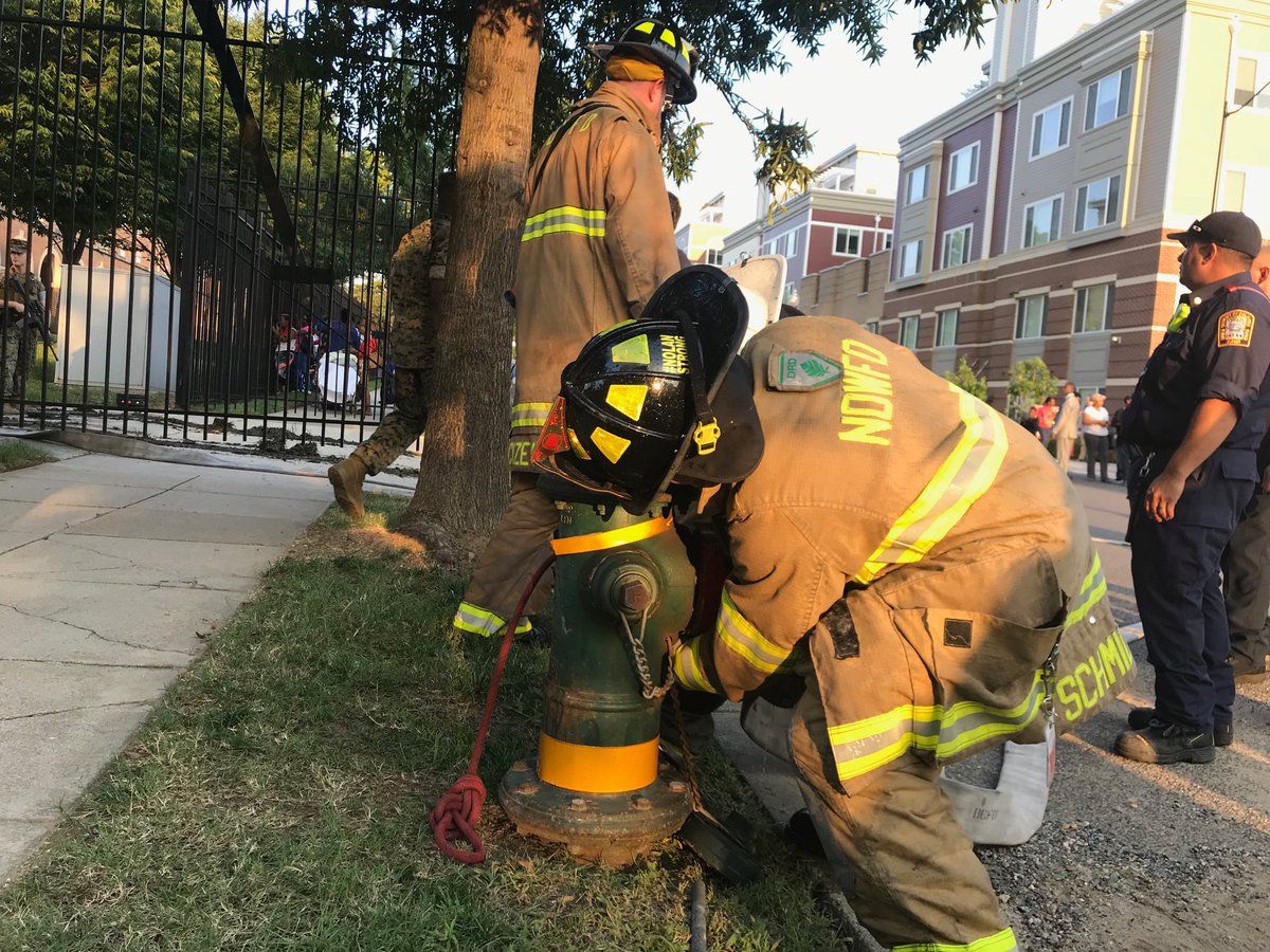 Around 6 p.m., it was three hours after the fire started and firefighters were still battling flames at the apartment building. (WTOP/Dick Uliano)