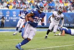 EAST RUTHERFORD, NJ - SEPTEMBER 09:  Saquon Barkley #26 of the New York Giants runs with the ball in the second half against the Jacksonville Jaguars at MetLife Stadium on September 9, 2018 in East Rutherford, New Jersey.  (Photo by Mike Lawrie/Getty Images)