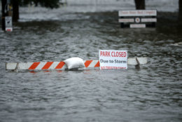 NEW BERN, NC - SEPTEMBER 13:  A sign warns people away from Union Point Park after is was flooded by the Neuse River during Hurricane Florence September 13, 2018 in New Bern, North Carolina. Coastal cities in North Carolina, South Carolina and Virginia are under evacuation orders as the Category 2 hurricane approaches the United States.  (Photo by Chip Somodevilla/Getty Images)