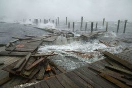 ATLANTIC BEACH, NC - SEPTEMBER 13:  Portions of a boat dock and boardwalk are destroyed by powerful wind and waves as Hurricane Florence arrives September 13, 2018 in Atlantic Beach, United States. Coastal cities in North Carolina, South Carolina and Virginia are under evacuation orders as the Category 2 hurricane approaches the United States.  (Photo by Chip Somodevilla/Getty Images)