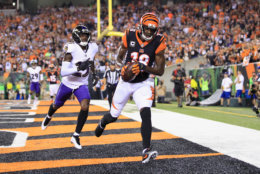 CINCINNATI, OH - SEPTEMBER 13:  A.J. Green #18 of the Cincinnati Bengals scores a touchdown against Tavon Young #25 of the Baltimore Ravens during the first quarter at Paul Brown Stadium on September 13, 2018 in Cincinnati, Ohio.  (Photo by Andy Lyons/Getty Images)