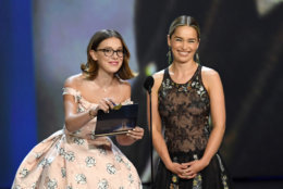 LOS ANGELES, CA - SEPTEMBER 17: Millie Bobby Brown (L) and Emilia Clarke speak onstage during the 70th Emmy Awards at Microsoft Theater on September 17, 2018 in Los Angeles, California. (Photo by Kevin Winter/Getty Images)