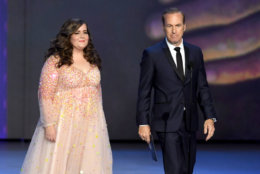 LOS ANGELES, CA - SEPTEMBER 17:  Aidy Bryant (L) and Bob Odenkirk walk onstage during the 70th Emmy Awards at Microsoft Theater on September 17, 2018 in Los Angeles, California.  (Photo by Kevin Winter/Getty Images)