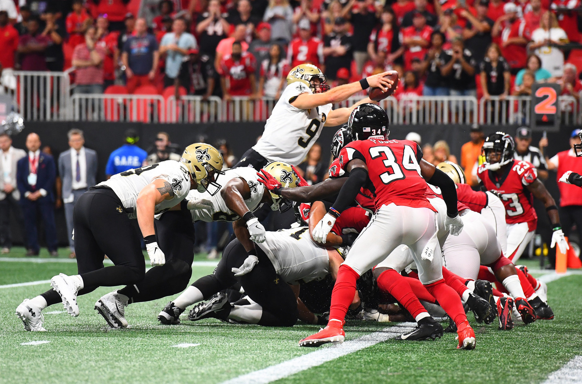 ATLANTA, GA - SEPTEMBER 23: Drew Brees #9 of the New Orleans Saints scores the game-winning touchdown in overtime against the Atlanta Falcons at Mercedes-Benz Stadium on September 23, 2018 in Atlanta, Georgia. (Photo by Scott Cunningham/Getty Images)