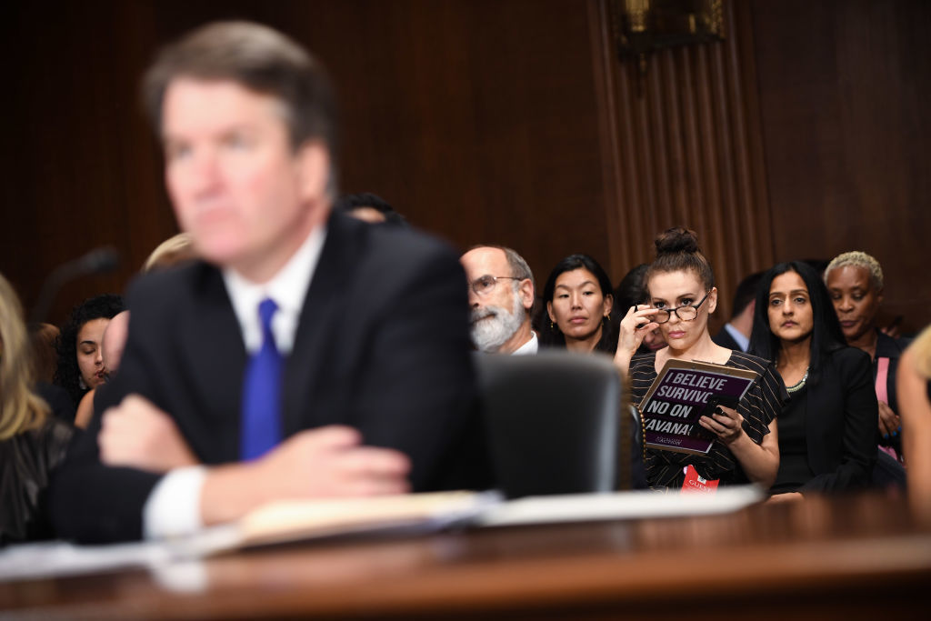 WASHINGTON, DC - SEPTEMBER 27: Actress and activist Alyssa Milano (R) listens to Supreme Court nominee Brett Kavanaugh as he testifies before the U.S. Senate Judiciary Committee on Capitol Hill on September 27, 2018 in Washington, DC. Kavanaugh was called back to testify about claims by Dr. Christine Blasey Ford, who has accused him of sexually assaulting her during a party in 1982 when they were high school students in suburban Maryland. (Photo by Saul Loeb - Pool /Getty Images)
