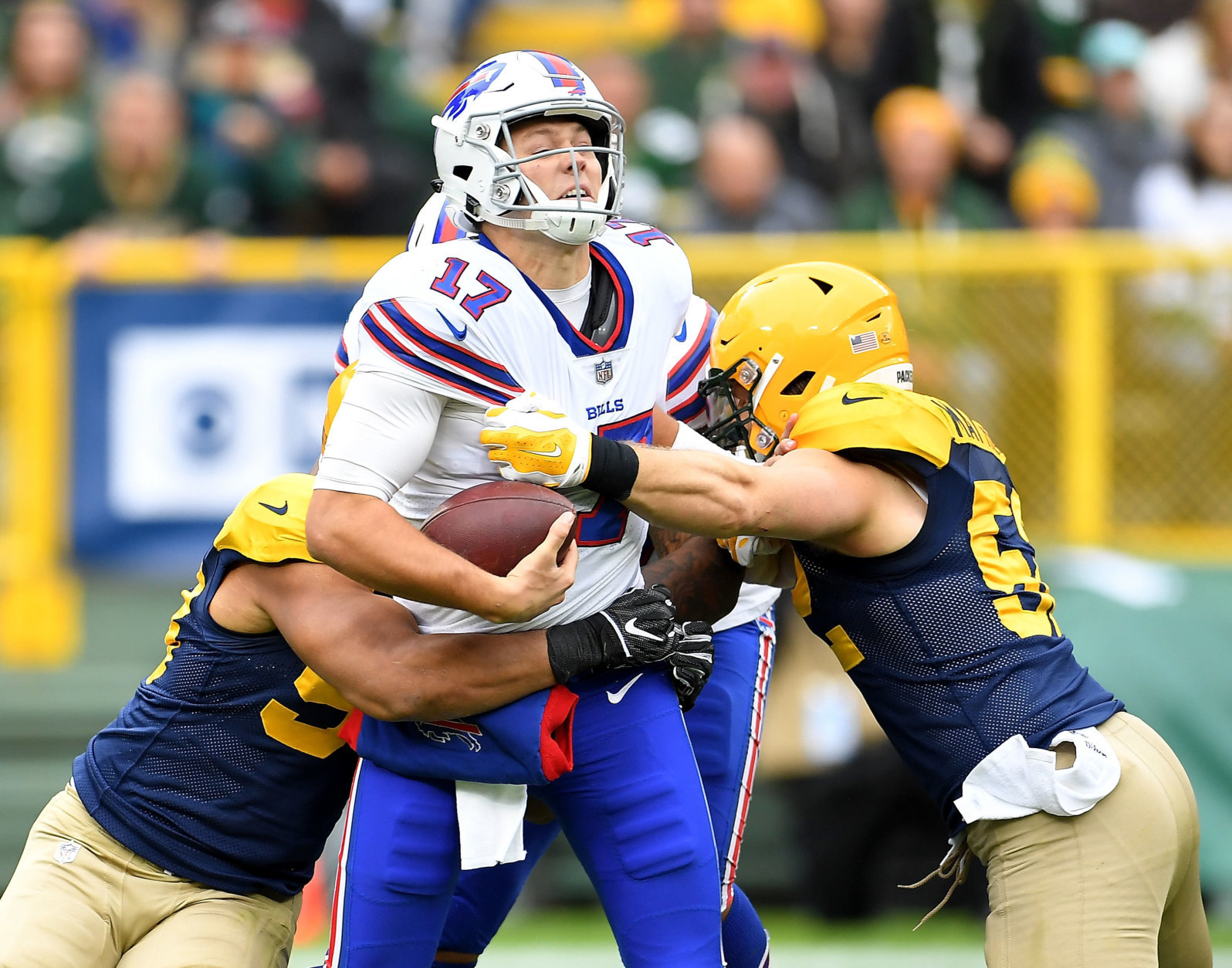 GREEN BAY, WI - SEPTEMBER 30:  Josh Allen #17 of the Buffalo Bills is sacked by Nick Perry #53 of the Green Bay Packers and Clay Matthews #52 during the second quarter of a game at Lambeau Field on September 30, 2018 in Green Bay, Wisconsin.  (Photo by Stacy Revere/Getty Images)
