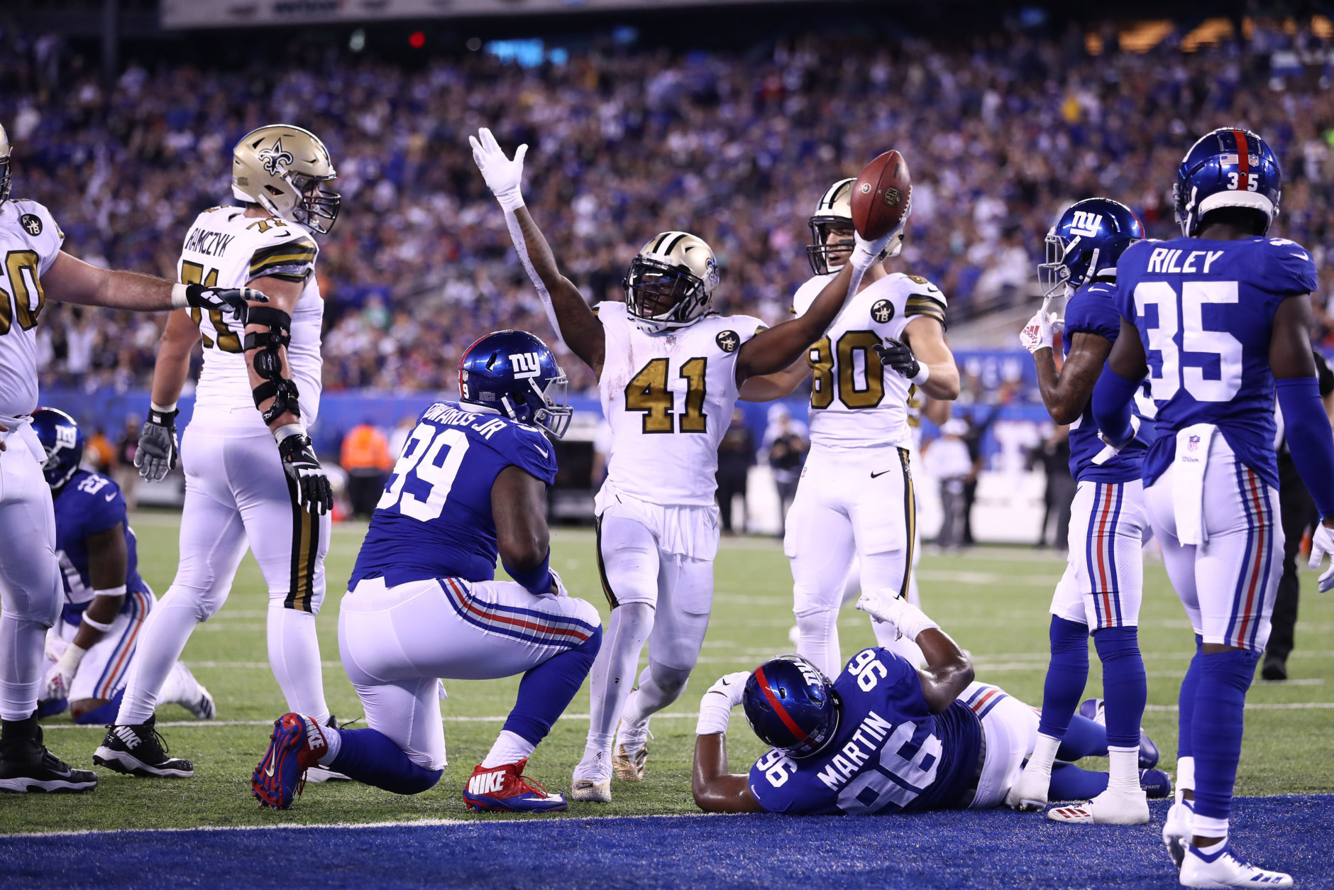 EAST RUTHERFORD, NEW JERSEY - SEPTEMBER 30:  Alvin Kamara #41 of the New Orleans Saints scores a touchdown against the New York Giants during their game at MetLife Stadium on September 30, 2018 in East Rutherford, New Jersey. (Photo by Al Bello/Getty Images)