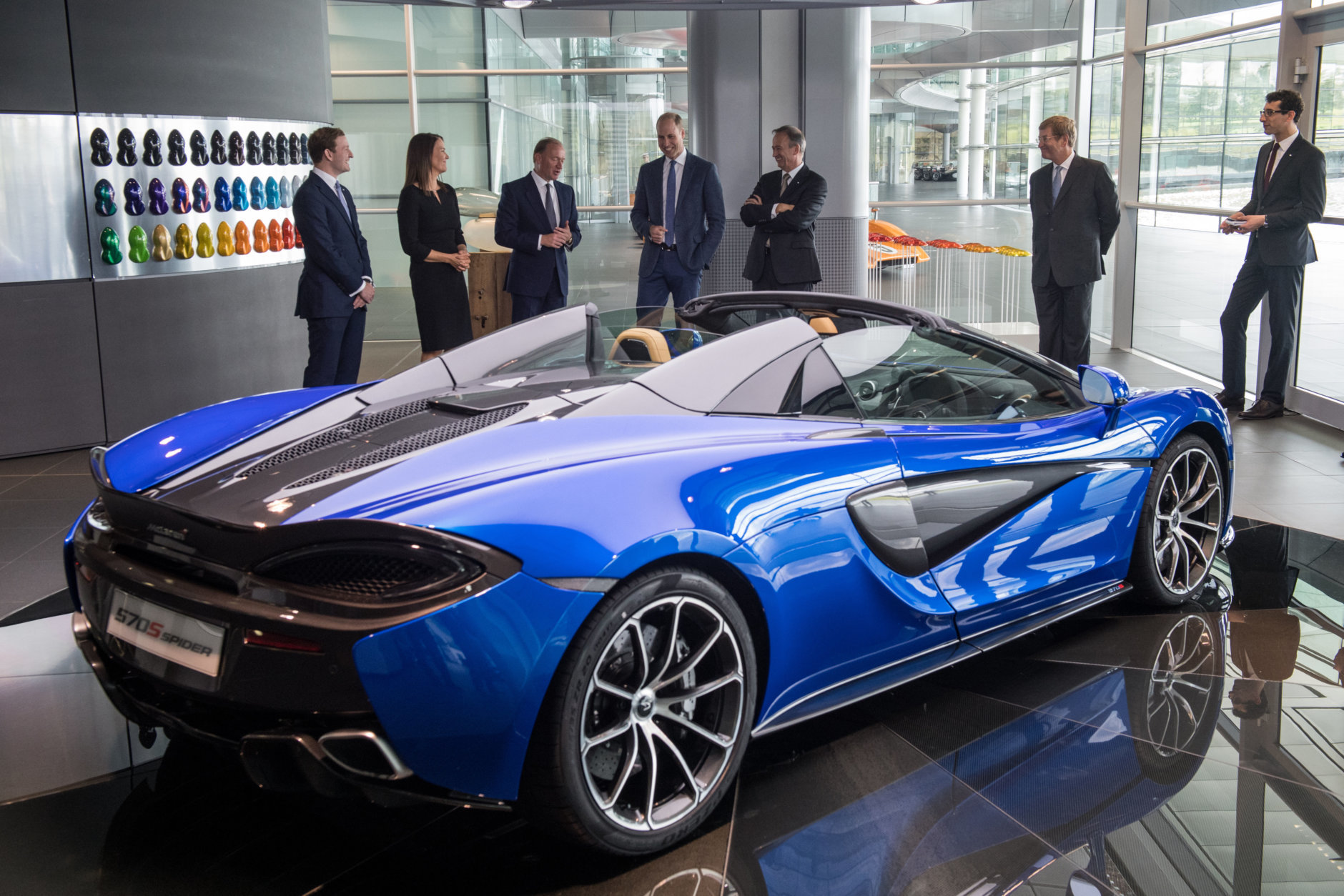 WOKING, ENGLAND - SEPTEMBER 12:   Prince William, Duke of Cambridge (C) is shown a McLaren 720S, by Mike Flewitt (3rd L), CEO of McLaren Automative during a visit to McLaren Automotive at McLaren Technology Centre on September 12, 2017 in Woking, England.  (Photo by Chris J Ratcliffe - WPA Pool/Getty Images)