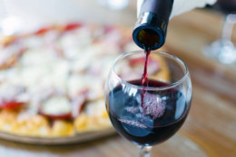 Surrender to the siren call of carryout pizza and a good bottle of wine. (Getty Images) 