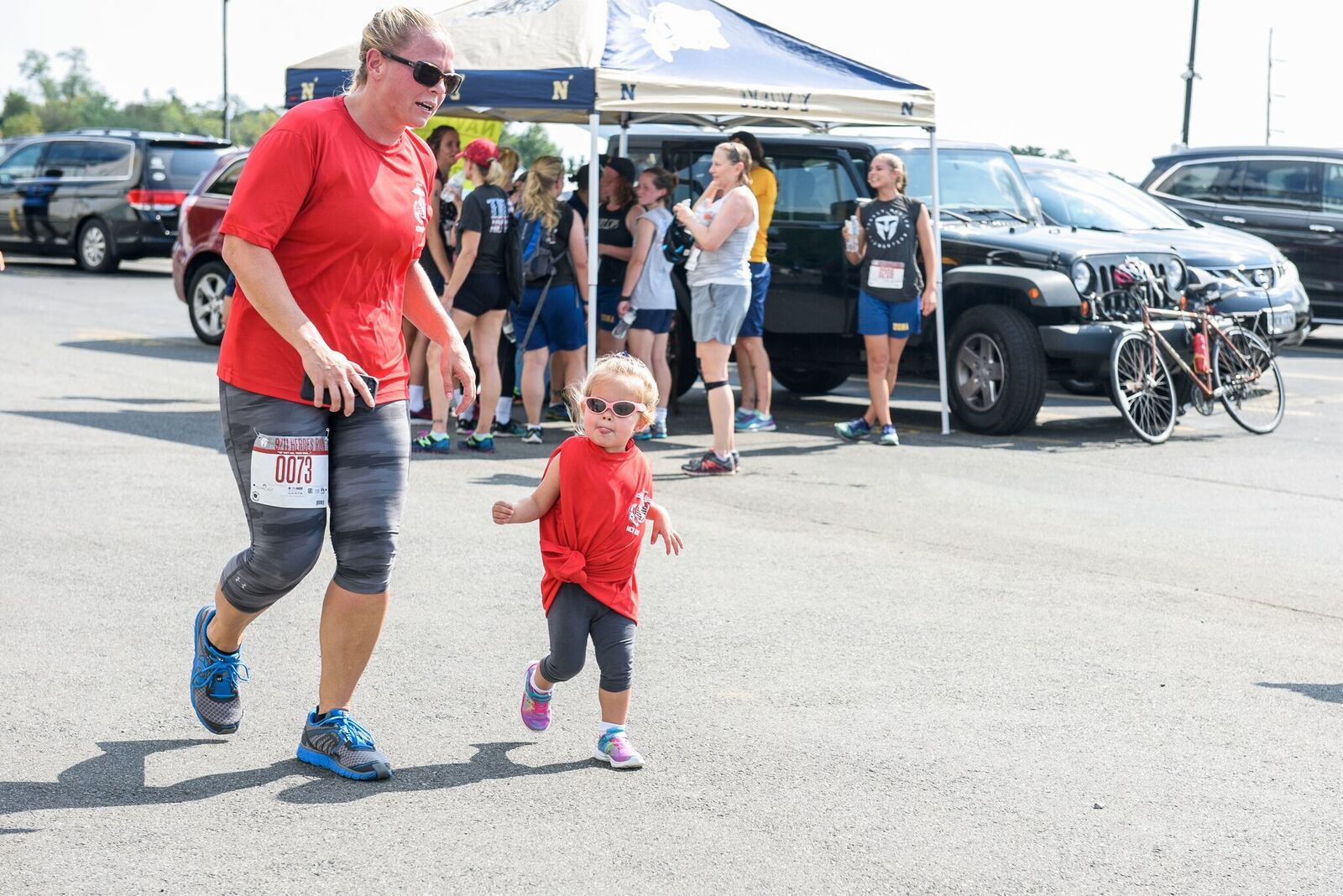 Mom and daughter duo attend the 2017, 1 Mile family fun run rocking sunglasses. (Courtesy Megan Evans Photography)