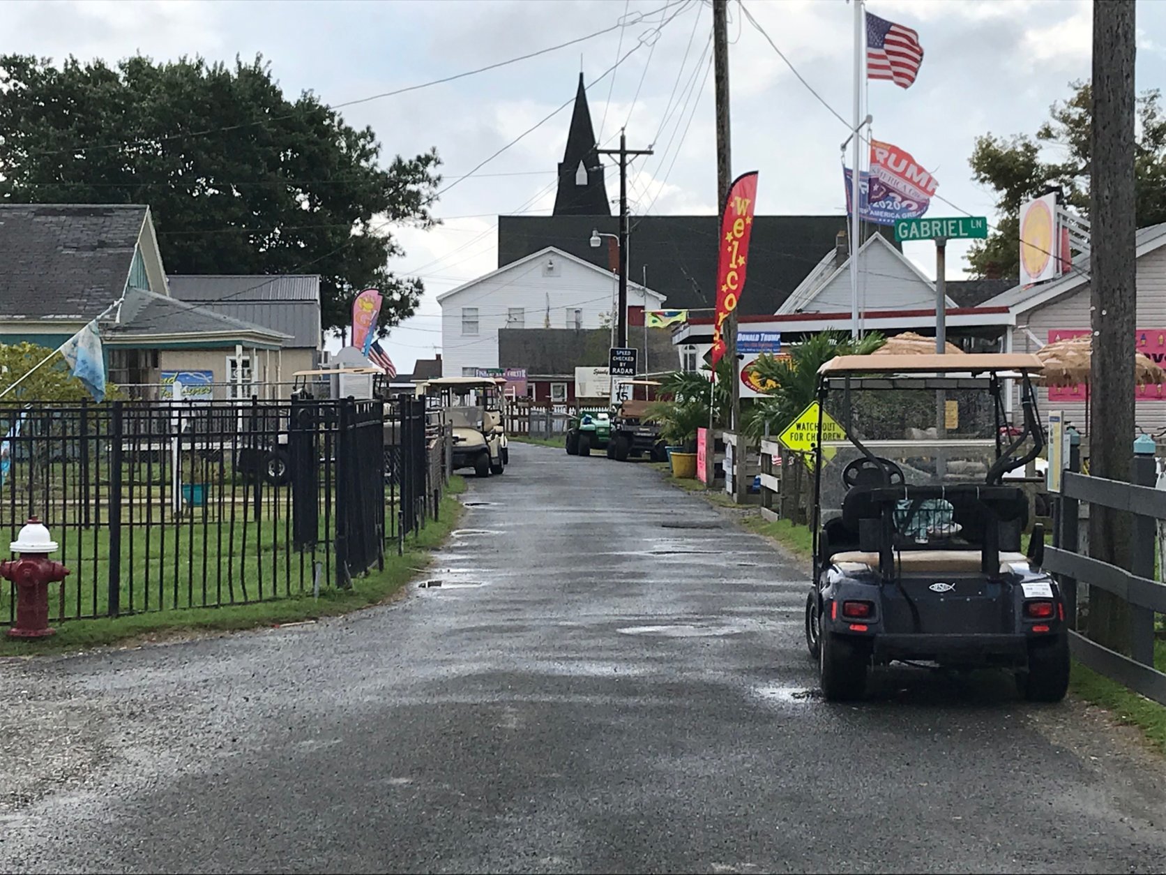 Golf carts and bicycles are the most common form of transportation on Tangier Island’s narrow streets. There are few cars. (WTOP/Michelle Basch)