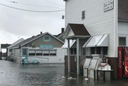Flooding is not unusual on Tangier Island, which is only about 4 feet above sea level. Here, the front of a restaurant and a store are experiencing flooding on  Sunday, Sept. 9, 2018. (WTOP/Michelle Basch)