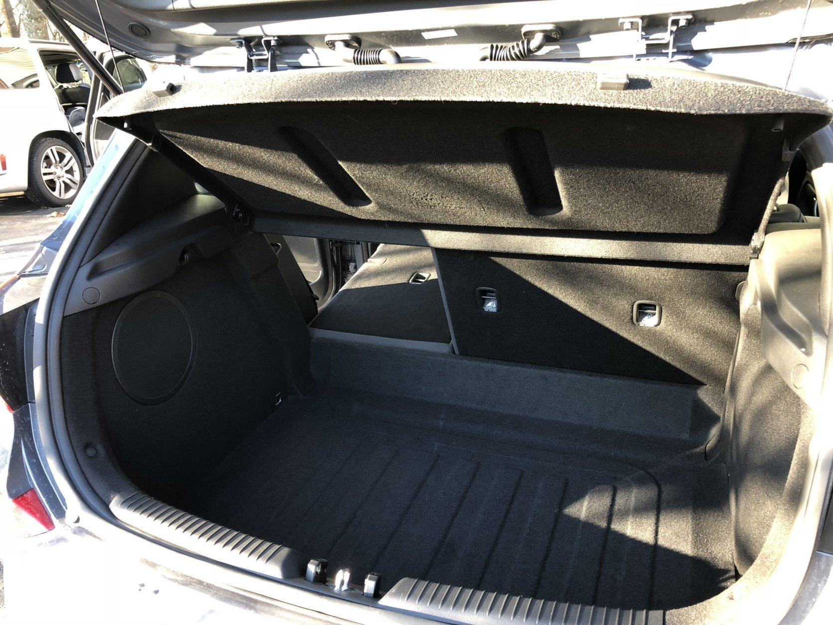 The cargo area is good for this class, and folding down the back seat gives you more room for large items, though I wish for an even rear floor to folded rear seat. (WTOP/Mike Parris)