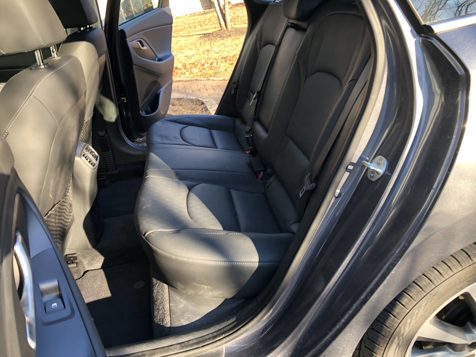 Back seats have good leg room, but the headroom isn’t great, with the optional panoramic sunroof. Taller riders better stick to the front seat. (WTOP/Mike Parris)