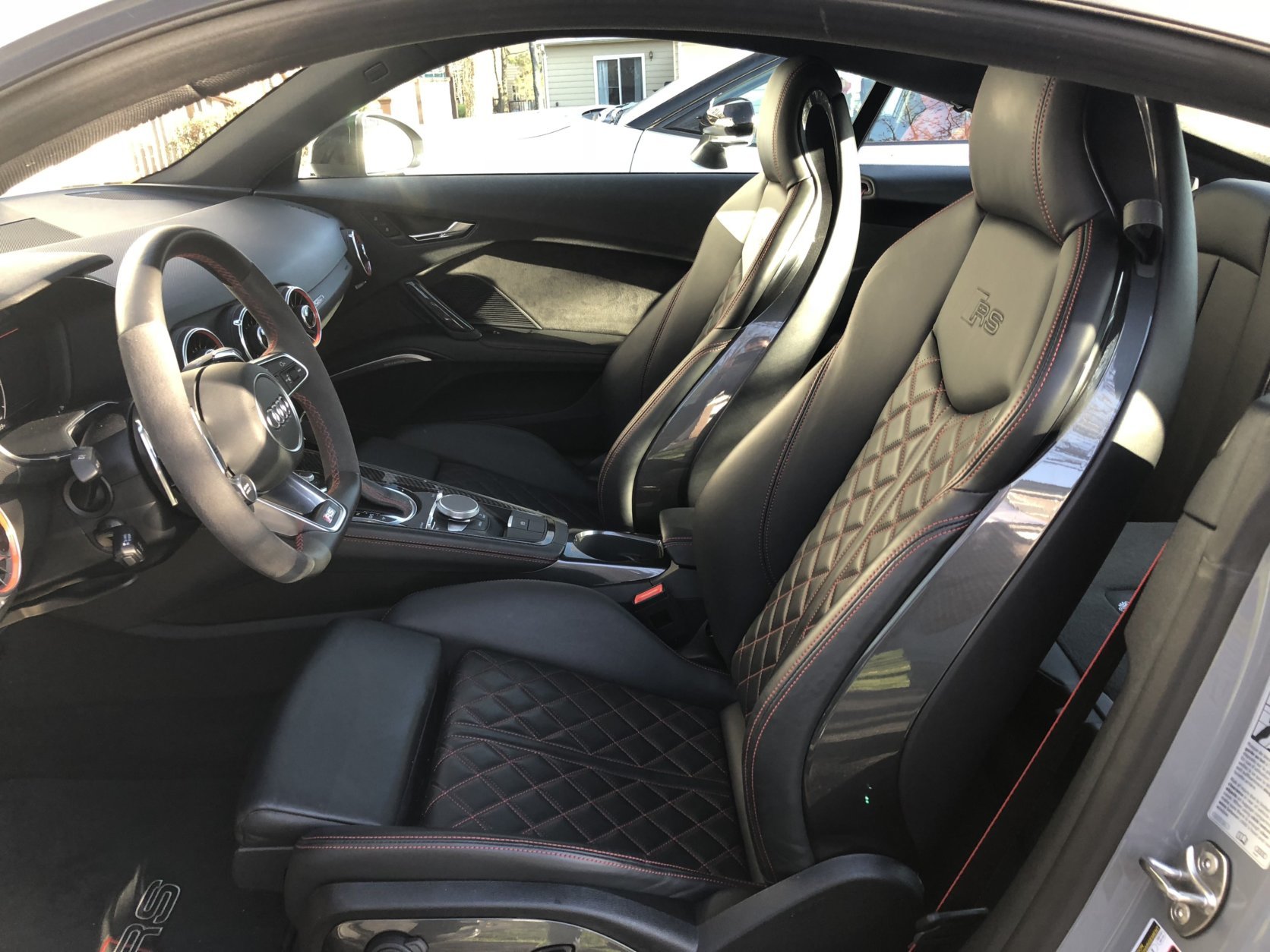 The interior isn’t some stripped out shell in the name of speed. The Audi has speed and luxury trimming inside. High quality Nappa leather seats hug your body and keep you in place in turns. (WTOP/Mike Parris)